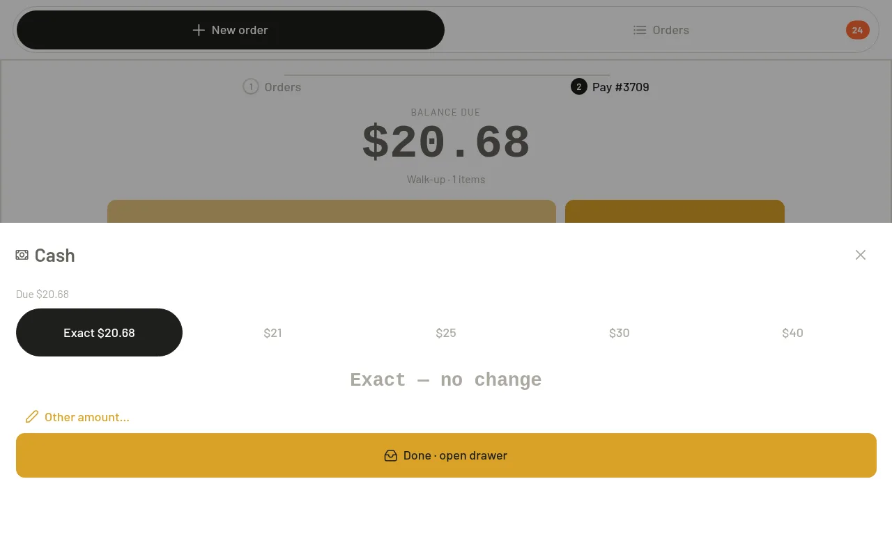 The register's cash tender screen showing quick-cash amounts and the exact change due